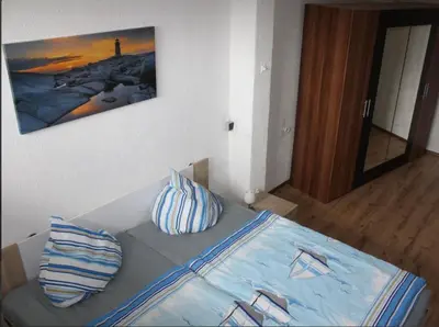Ein Bett oder Betten in einem Zimmer der Unterkunft zum Schilfrohr