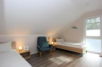 Ein Bett oder Betten in einem Zimmer der Unterkunft Darßkönig