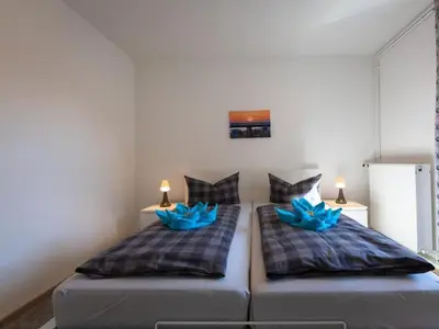 Ein Bett oder Betten in einem Zimmer der Unterkunft Holiday apartment Ahrenshoop