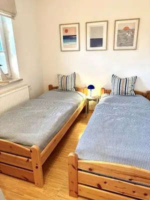 Ein Bett oder Betten in einem Zimmer der Unterkunft Ferienhaus Chausseestraße App 01