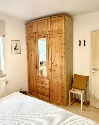 Ein Bett oder Betten in einem Zimmer der Unterkunft Ferienhaus Chausseestraße App 01