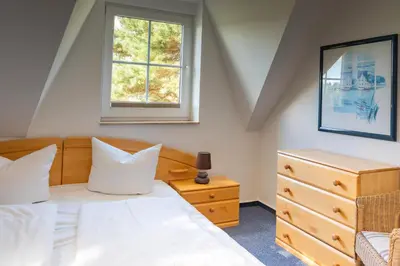 Ein Bett oder Betten in einem Zimmer der Unterkunft Am Deich Haus 36