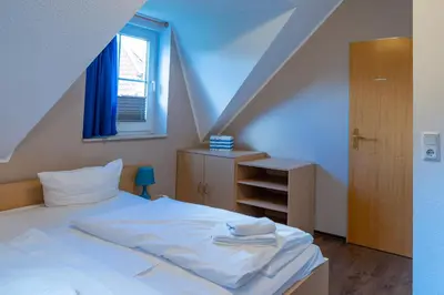 Ein Bett oder Betten in einem Zimmer der Unterkunft Am Deich Haus 32