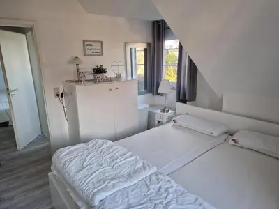 Ein Bett oder Betten in einem Zimmer der Unterkunft Jordanstr 35 Whg 5
