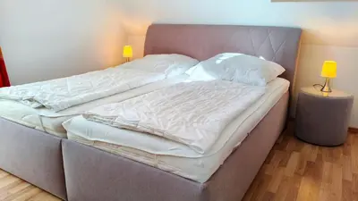 Ein Bett oder Betten in einem Zimmer der Unterkunft Villa Carpe Diem Wohnung 9