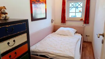 Ein Bett oder Betten in einem Zimmer der Unterkunft Villa Carpe Diem Wohnung 9