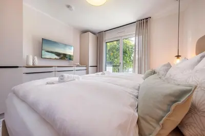 Ein Bett oder Betten in einem Zimmer der Unterkunft Strandvilla Zingst-AP 16
