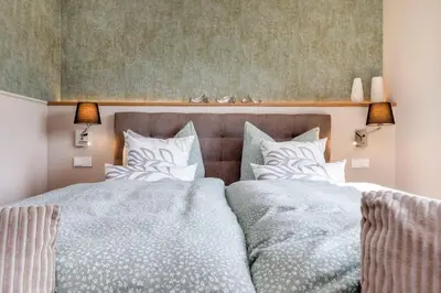Ein Bett oder Betten in einem Zimmer der Unterkunft Strandvilla Zingst-AP 16