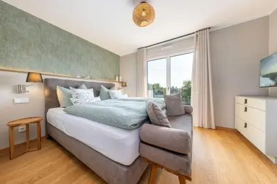 Ein Bett oder Betten in einem Zimmer der Unterkunft Strandvilla Zingst-AP 16