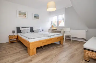 Ein Bett oder Betten in einem Zimmer der Unterkunft Stuermann