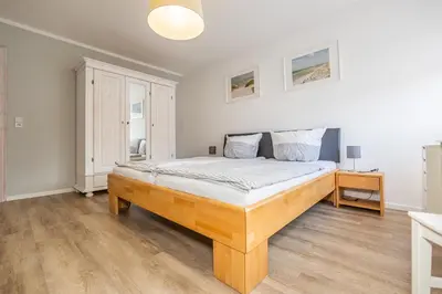 Ein Bett oder Betten in einem Zimmer der Unterkunft Stuermann