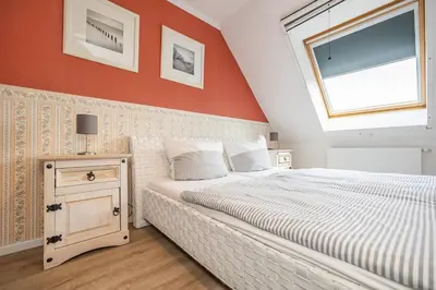 Ein Bett oder Betten in einem Zimmer der Unterkunft Stuermann