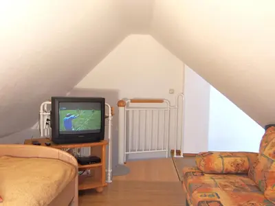TV/Unterhaltungsangebot in der Unterkunft Birkmaase 12 Kapitänshaus Jacqueline 4-Sterne Komfort Maisonette im OG rechts