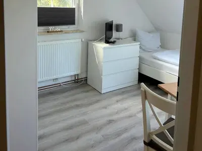 Ein Bett oder Betten in einem Zimmer der Unterkunft Am Deich Haus 18
