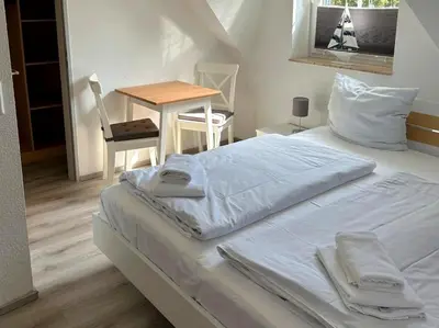 Ein Bett oder Betten in einem Zimmer der Unterkunft Am Deich Haus 18