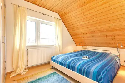 Ein Bett oder Betten in einem Zimmer der Unterkunft Fewo Möwe