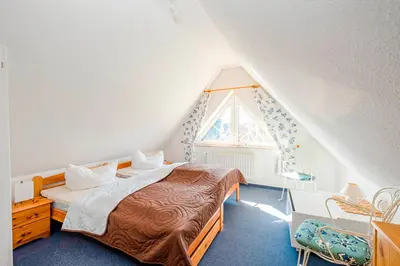 Ein Bett oder Betten in einem Zimmer der Unterkunft Haus Seeschwalbe Fewo Nr 7