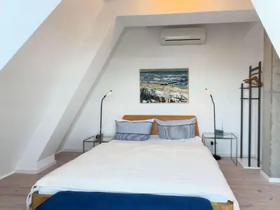 Ein Bett oder Betten in einem Zimmer der Unterkunft Speicherresidenz App 7 1 Weitmeer