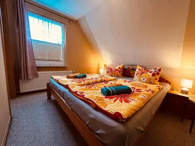 Ein Bett oder Betten in einem Zimmer der Unterkunft Karina II