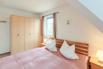 Ein Bett oder Betten in einem Zimmer der Unterkunft Haus Kormoran, Fewo Nr 3