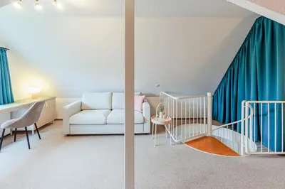Ein Sitzbereich in der Unterkunft Haus Kormoran, Fewo Nr 3