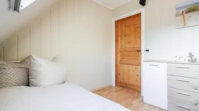 Ein Bett oder Betten in einem Zimmer der Unterkunft Ferienhaus Poolaris