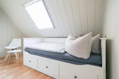 Ein Bett oder Betten in einem Zimmer der Unterkunft Ferienhaus Poolaris