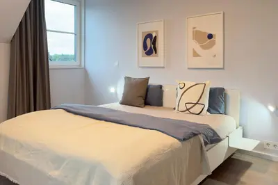 Ein Bett oder Betten in einem Zimmer der Unterkunft Ferienhäuser Baltic Lagoon Haus 16 
