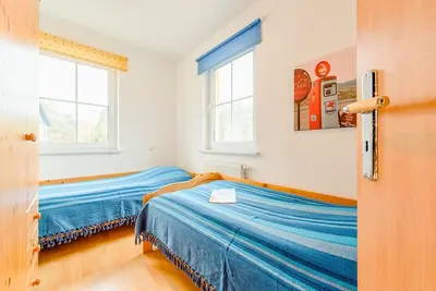 Ein Bett oder Betten in einem Zimmer der Unterkunft Fewo am Waldrand, untere Whg