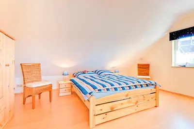 Ein Bett oder Betten in einem Zimmer der Unterkunft Ferienhaus LampRieger Fewo 1 OG