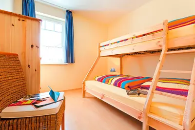 Ein Bett oder Betten in einem Zimmer der Unterkunft Ferienhaus LampRieger, Fewo Parter