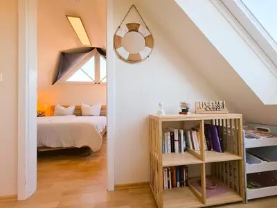 Ein Bett oder Betten in einem Zimmer der Unterkunft Sehnsuchtsort Zingst - strandnahe Ferienwohnung, Hund willkommen
