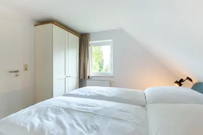 Ein Bett oder Betten in einem Zimmer der Unterkunft Boddenräuber 4