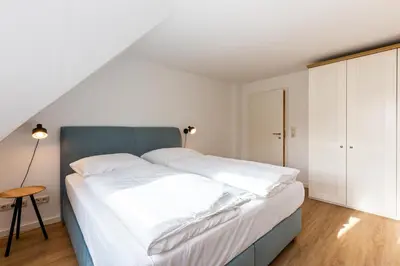 Ein Bett oder Betten in einem Zimmer der Unterkunft Boddenräuber 5
