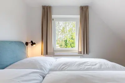 Ein Bett oder Betten in einem Zimmer der Unterkunft Boddenräuber 5
