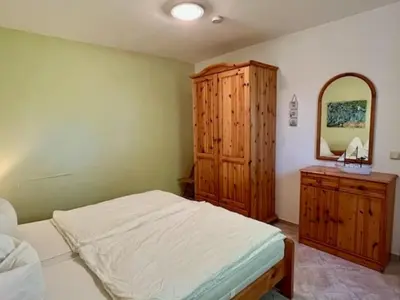 Ein Bett oder Betten in einem Zimmer der Unterkunft Haus Sonnenwinkel, FeWo 3