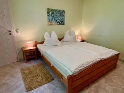 Ein Bett oder Betten in einem Zimmer der Unterkunft Haus Sonnenwinkel, FeWo 3