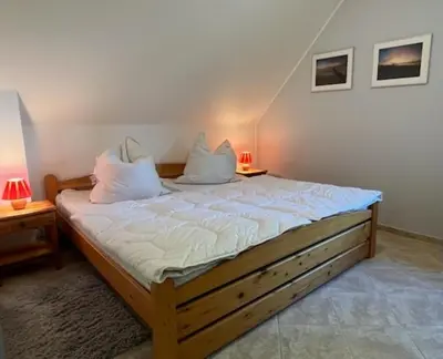 Ein Bett oder Betten in einem Zimmer der Unterkunft Haus Sonnenwinkel, FeWo 2