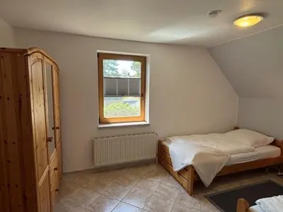 Ein Bett oder Betten in einem Zimmer der Unterkunft Haus Sonnenwinkel, FeWo 1