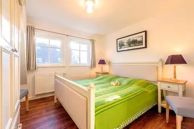 Ein Bett oder Betten in einem Zimmer der Unterkunft Ferienhaus Rosenberg