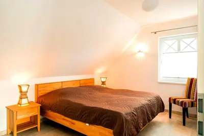 Ein Bett oder Betten in einem Zimmer der Unterkunft Inseltraum Whg Seeschwalbe 1Et li