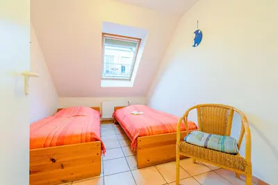 Ein Bett oder Betten in einem Zimmer der Unterkunft Haus Strandperle Fewo Nr 12