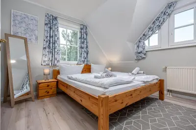 Ein Bett oder Betten in einem Zimmer der Unterkunft Reihenendhaus Celebes