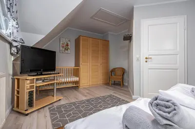 Ein Bett oder Betten in einem Zimmer der Unterkunft Reihenendhaus Celebes
