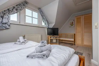 Ein Bett oder Betten in einem Zimmer der Unterkunft Reihenendhaus Celebes