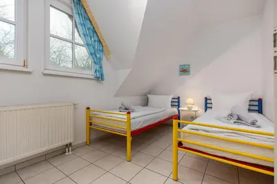 Ein Bett oder Betten in einem Zimmer der Unterkunft Reihenmittelhaus Toraya