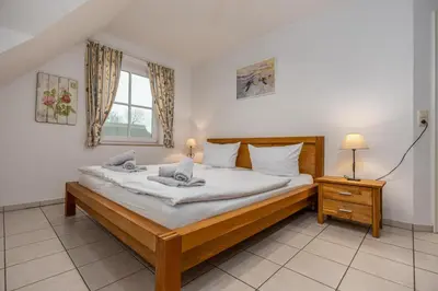 Ein Bett oder Betten in einem Zimmer der Unterkunft Reihenendhaus Polar