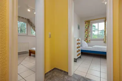 Ein Bett oder Betten in einem Zimmer der Unterkunft Reihenendhaus Polar