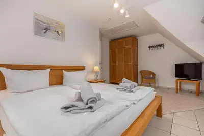 Ein Bett oder Betten in einem Zimmer der Unterkunft Reihenendhaus Polar