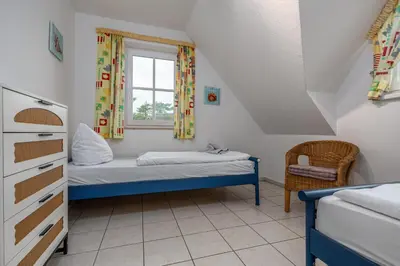 Ein Bett oder Betten in einem Zimmer der Unterkunft Reihenendhaus Polar